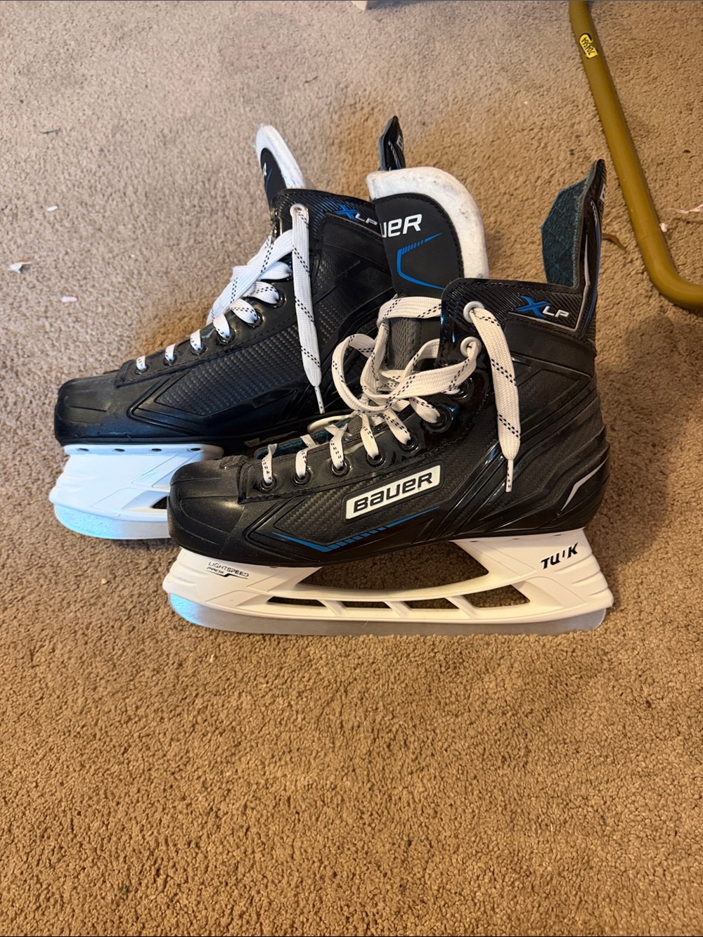 Bauer XLP Black and White Ice Hockey Skates with Blue Accents